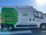 a van parked in a parking lot with a sign on the side of it
