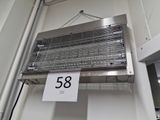 a sign hanging from the ceiling of a kitchen