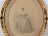 an old picture of a woman in a dress is shown in a gold frame