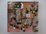 a picture of a picture of a box of buttons