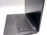 a laptop with a black keyboard on a white surface