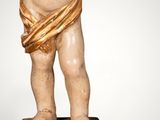 an image of a statue of a child with a bow on his head