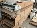 a pile of cardboard boxes stacked on top of each other