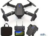 a close up of a drone with a camera and a bag
