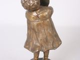 bronze figurine of a boy and girl hugging each other on a marble base