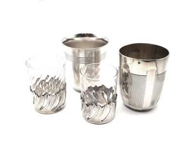 three cups that are sitting next to each other on a table