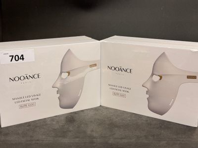 two boxes of noosance products sitting on a table