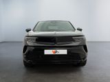 the front view of a black car in a white room