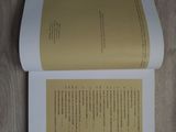 a book that is open on a wooden floor