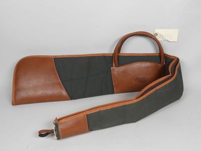 an image of a brown and black leather gun case