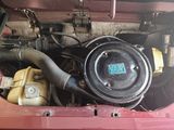 a picture of a car engine with its hood open