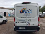 a van that is parked in front of a building