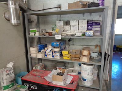 a room with a lot of items on the shelves