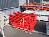 a large pile of red boxes on the back of a truck