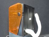 a phone that is connected to a cord on a table
