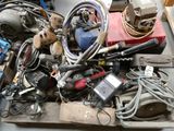 a pile of assorted electrical equipment sitting on a table