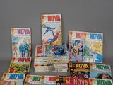 a lot of comic books sitting on a table