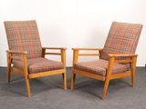pair of mid century danish lounge chairs with plaid upholstered cushions