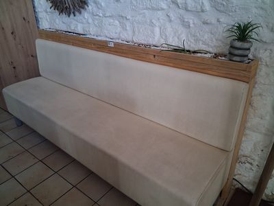 a couch that is sitting in front of a wall