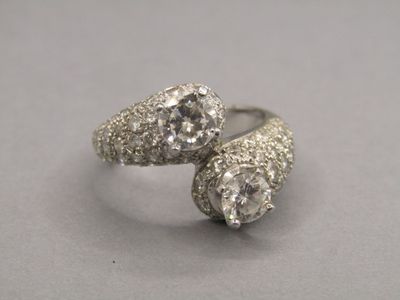 pair of two diamond rings sitting on top of each other
