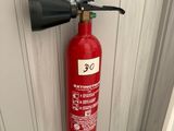 a fire extinguisor attached to a wall