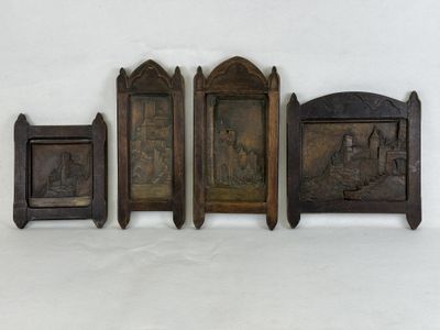 three wooden plaques with a picture of a man and a woman on them
