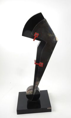 sculpture of a black sculpture with a red handle on a black base