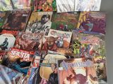 a lot of comic books that are on the table