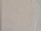 a close up of a white plate on a blue table