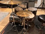 the drum kit is ready to be used in the recording room