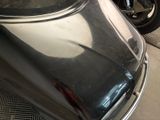 two motorcycles parked next to each other in a garage