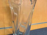 a glass vase that is sitting on a table