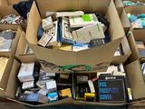 a box full of electronic devices sitting on the ground