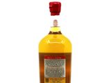 an image of a bottle of whisky sitting on top of a white surface