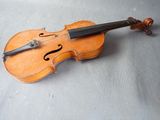 a violin that is laying on the floor