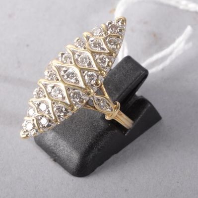 an image of a gold and diamond ring sitting on top of a black ring holder