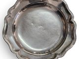 silver plate with scallop edge on a white background