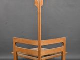 a wooden bench with a lamp on top of it