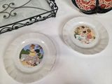 two plates with pictures of children on them on a table