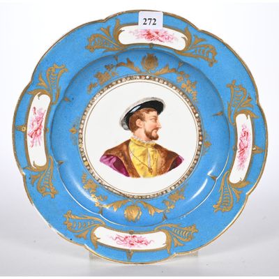 une assiette bleue sur laquelle est représenté un homme