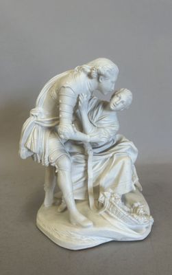 a white statue of a man and a woman sitting on a bench