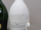 a bottle of champagne next to a bottle of wine