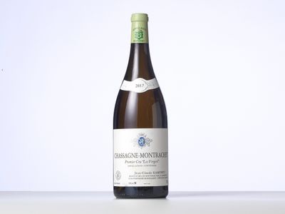 the bottle of wine is sitting on the table with a white background