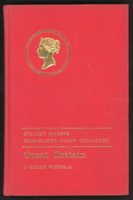 a red book with a gold medallion on the cover