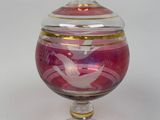 purple and gold glass bowl with lid with a bird on it
