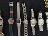 a lot of watches that are sitting on a table