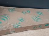 a cardboard box with a pattern on it sitting on the floor