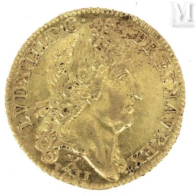a close up of a gold coin on a white surface