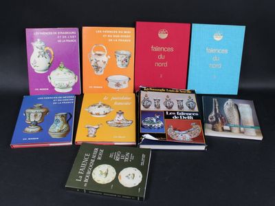 several books on a black table with a black background