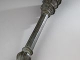 an antique silver metal door handle on a white surface